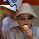 Elderly women eat ice-cream at Tokyo's Sugamo district, an area popular among Japanese elderly, in Tokyo